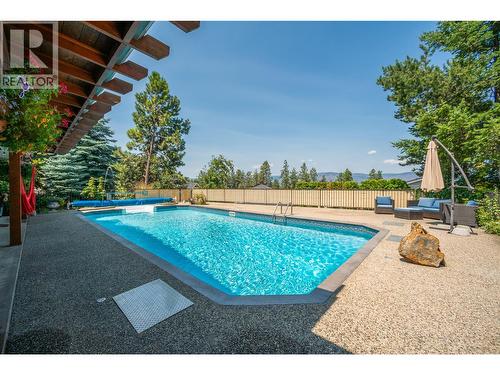514 Hawes Court, Kelowna, BC - Outdoor With In Ground Pool With Backyard