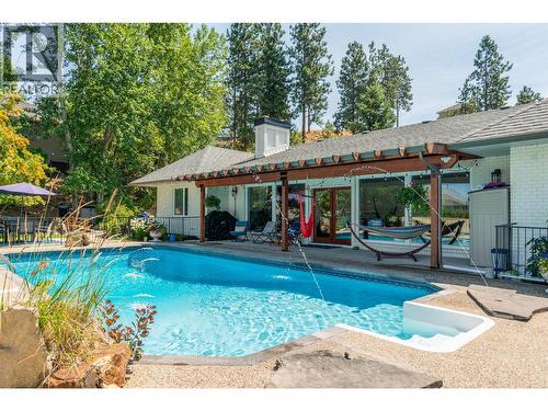 514 Hawes Court, Kelowna, BC - Outdoor With In Ground Pool With Deck Patio Veranda With Backyard