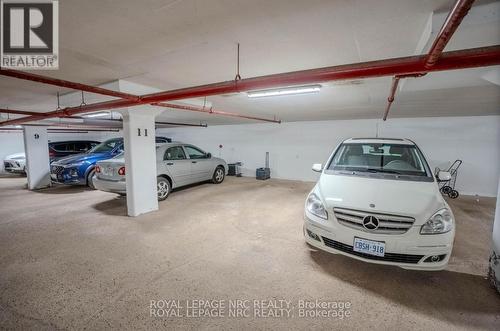 201 - 81 Scott Street, St. Catharines (Lakeport), ON - Indoor Photo Showing Garage