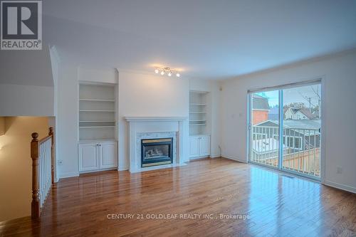 4 Schoolhouse Private, Ottawa, ON - Indoor Photo Showing Living Room With Fireplace