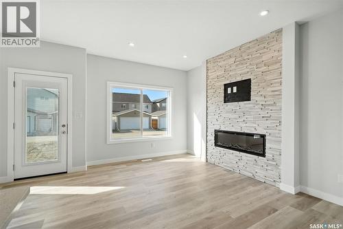 522 Myles Heidt Manor, Saskatoon, SK - Indoor Photo Showing Living Room With Fireplace