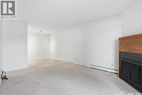 105B 4040 8Th Street E, Saskatoon, SK - Indoor Photo Showing Other Room With Fireplace