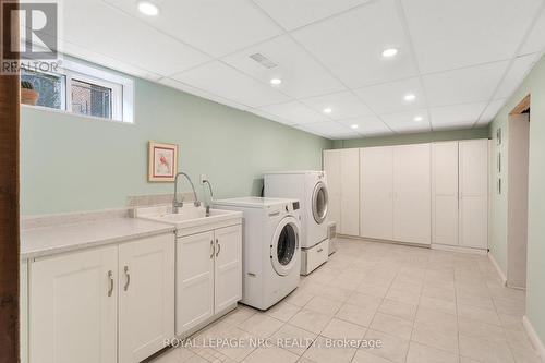 Lower level laundry room with storage - 31 St Lawrence Drive, St. Catharines (Bunting/Linwell), ON - Indoor Photo Showing Laundry Room