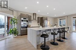 Deslaurier cabinets and breakfast bar with storage - 