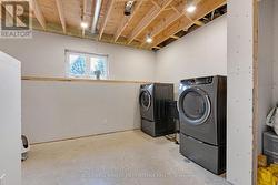 Lower level laundry room with Bosch washer & dryer - 