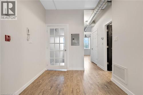 A view looking at the entry door.  With a bedroom, bathroom, laundry and closet - 31 Main Street Unit# 301, Cambridge, ON - Indoor Photo Showing Other Room