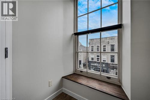 Window in living room looking out over Main Street (North facing) - 31 Main Street Unit# 301, Cambridge, ON - Indoor Photo Showing Other Room