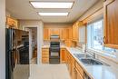 9-10505 Quinpool Road, Summerland, BC  - Indoor Photo Showing Kitchen With Double Sink 
