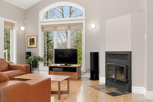 Living room - 204 Ch. De Chaumont, Saint-Adolphe-D'Howard, QC - Indoor Photo Showing Living Room With Fireplace