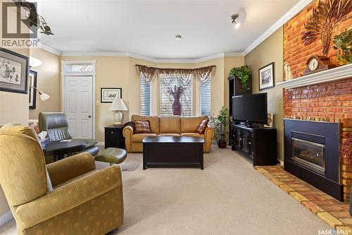 304 2925 14Th Avenue, Regina, SK - Indoor Photo Showing Living Room With Fireplace