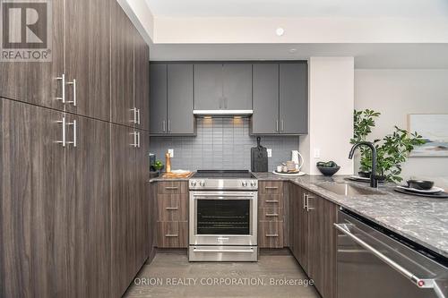 822 - 3240 William Coltson Avenue, Oakville, ON - Indoor Photo Showing Kitchen With Upgraded Kitchen