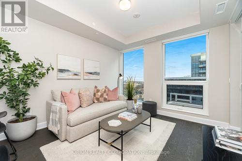 822 - 3240 William Coltson Avenue, Oakville, ON - Indoor Photo Showing Living Room With Fireplace