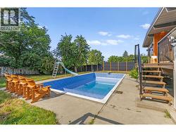Private fully fenced yard with a heated inground pool and all-day sun exposure. - 