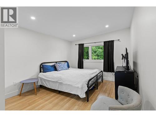 Generous primary bedroom offering comfort, privacy, and a relaxing retreat at the end of the day. - 1511 Lambert Avenue, Kelowna, BC - Indoor Photo Showing Bedroom