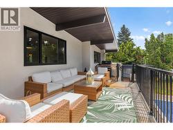 Expansive outdoor living space ideal for gatherings, sun-soaked relaxation, and summer entertaining. - 