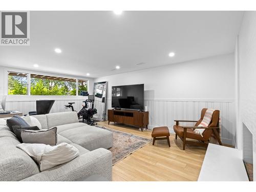 Spacious rec room ideal as a media room, gym, office, or kids area. - 1511 Lambert Avenue, Kelowna, BC - Indoor Photo Showing Other Room