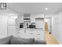 Updated suite kitchen offering great flexibility for guests or extended family. - 