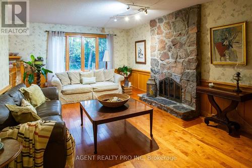 Family room with wood fireplace - 922 Country Club Crescent, London South (South Q), ON - Indoor Photo Showing Living Room With Fireplace