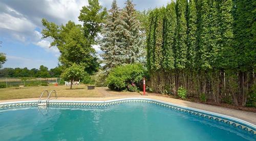 146 Wilkinson Crescent, Portage La Prairie, MB - Outdoor With In Ground Pool