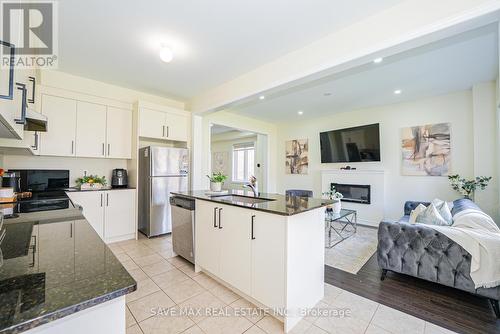 20 Bertram Gate, Whitby, ON - Indoor Photo Showing Kitchen With Fireplace