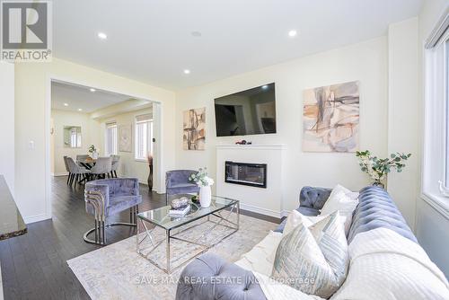 20 Bertram Gate, Whitby, ON - Indoor Photo Showing Living Room With Fireplace