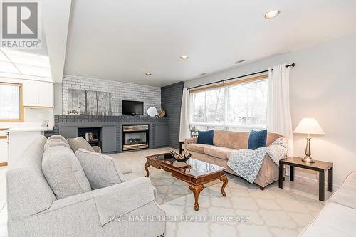 #B - 910 Concession Rd 17 W, Tiny, ON - Indoor Photo Showing Living Room With Fireplace