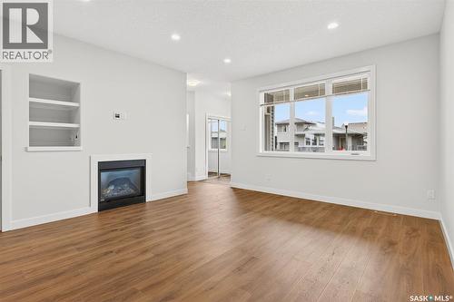 4125 Green Olive Way E, Regina, SK - Indoor Photo Showing Living Room With Fireplace