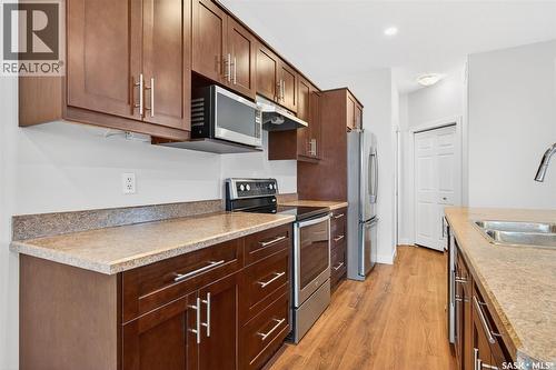 4125 Green Olive Way E, Regina, SK - Indoor Photo Showing Kitchen With Double Sink