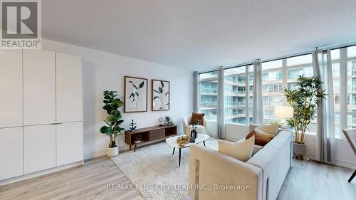830 - 10 Capreol Court, Toronto, ON - Indoor Photo Showing Living Room
