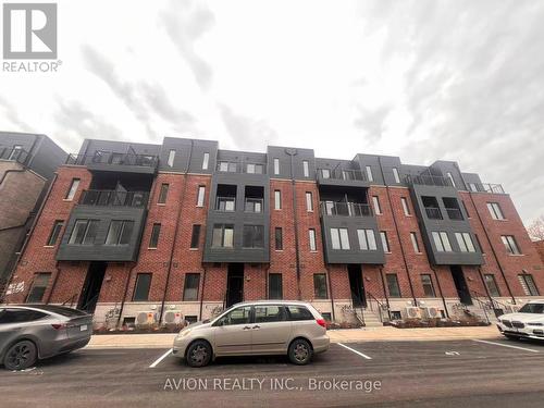 38 - 30 Calamint Lane, Toronto, ON - Outdoor With Facade