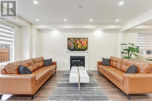 49 Ogston Crescent, Whitby, ON - Indoor Photo Showing Living Room With Fireplace