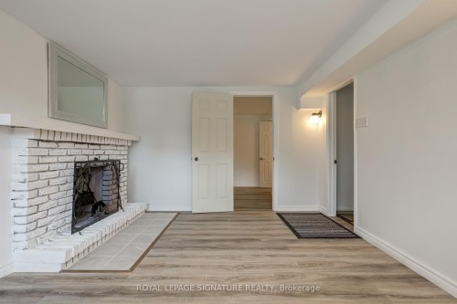 Lower-235 Cedar Crescent, Barrie, ON - Indoor Photo Showing Other Room With Fireplace