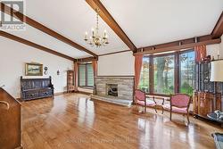 Vaulted Ceiling & Hardwood Flooring in Living Room - 