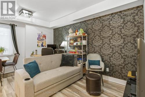 103 - 6065 Mcleod Road, Niagara Falls (Arad/Fallsview), ON - Indoor Photo Showing Living Room