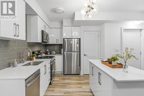 103 - 6065 Mcleod Road, Niagara Falls (Arad/Fallsview), ON - Indoor Photo Showing Kitchen With Upgraded Kitchen