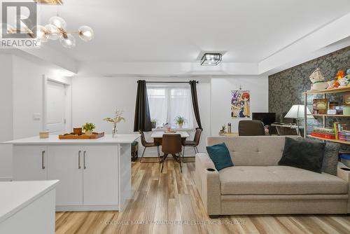 103 - 6065 Mcleod Road, Niagara Falls (Arad/Fallsview), ON - Indoor Photo Showing Living Room
