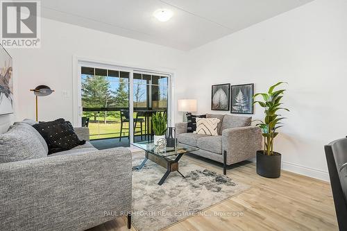 Virtually Staged-Living Room - 105 - 300 Montee Outaouais Street, Clarence-Rockland, ON - Indoor Photo Showing Living Room