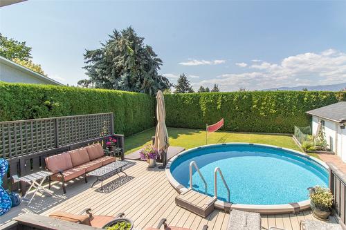 1310 Mary Court, Kelowna, BC - Outdoor With Above Ground Pool With Deck Patio Veranda
