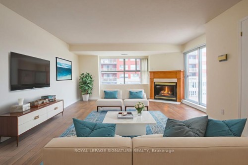 402-18 Concorde Place, Toronto, ON - Indoor Photo Showing Living Room With Fireplace