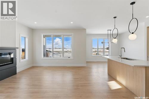 218 Veterans Drive, Warman, SK - Indoor With Fireplace