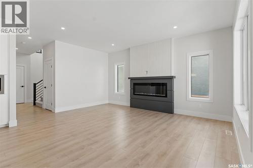 218 Veterans Drive, Warman, SK - Indoor Photo Showing Living Room With Fireplace