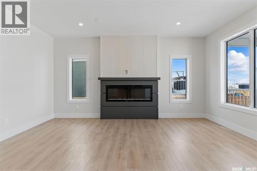 218 Veterans Drive, Warman, SK - Indoor Photo Showing Living Room With Fireplace