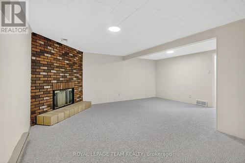 Large finished basement with new carpet. - 17 Providence Place, Ottawa, ON - Indoor With Fireplace