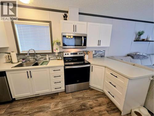 B3 5931 Cook Court, Prince George, BC - Indoor Photo Showing Kitchen With Double Sink