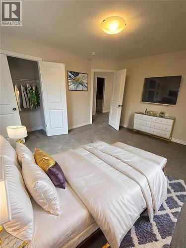 Bedroom featuring a closet and carpet - 12 Riddell Drive, Stratford, ON - Indoor Photo Showing Bedroom