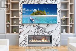 Floor to ceiling TV built-in and feature wall - 
