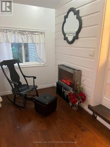 Sunroom - 24 King Street W, Kawartha Lakes (Omemee), ON - Indoor Photo Showing Other Room With Fireplace