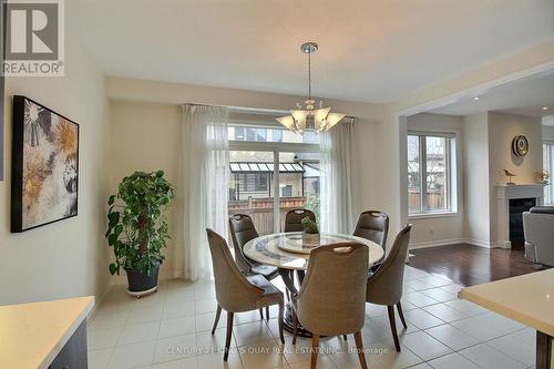 45 Chessington Avenue, East Gwillimbury, ON - Indoor Photo Showing Dining Room With Fireplace