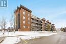 402 - 100 Dean Avenue, Barrie, ON  - Outdoor With Balcony With Facade 