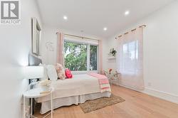 Generous sized bedroom facing majestic pine trees - 